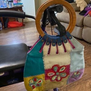 Beige canvas with sequin flower w gold ribbon. Painted on